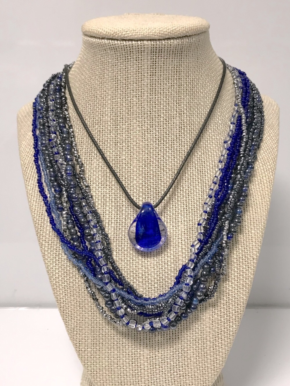 1 Multi Strand Blue Beaded Necklace & 1 Blue Glass Teardrop Pendant Necklace